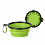 Green collapsible silicone pet travel bowl shown expanded and folded