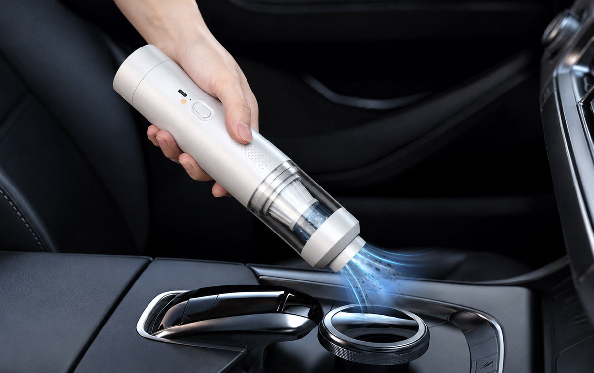 Portable handheld vacuum cleaning a car center console with a narrow nozzle