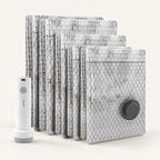 Travel Vacuum Bag Set with six grey patterned vacuum storage bags and a white rechargeable electric pump.